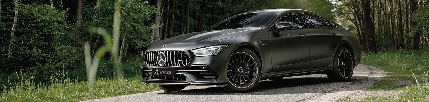 Mercedes AMG GT43S on a road in the forest